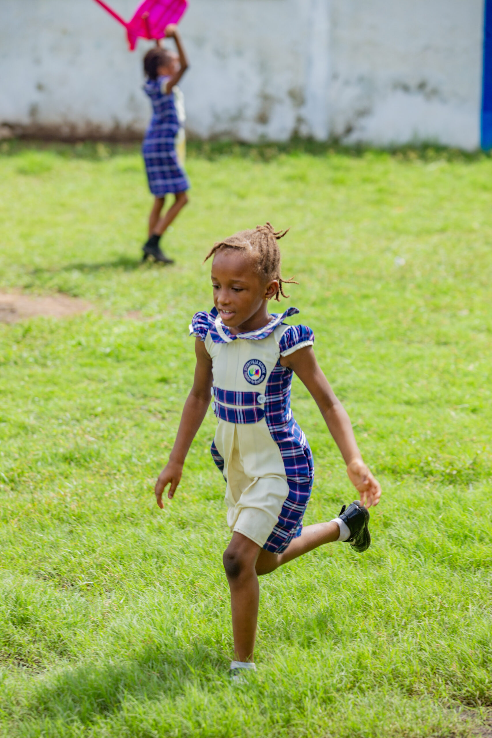 Students running on field Storyville Tamale